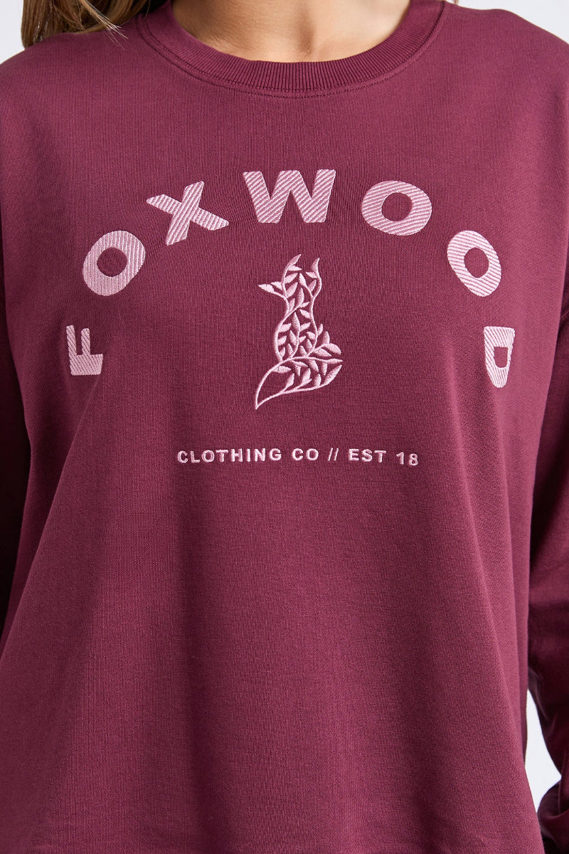 Maroon sweatshirt with 'FOXWOOD CLOTHING CO' logo on a white background