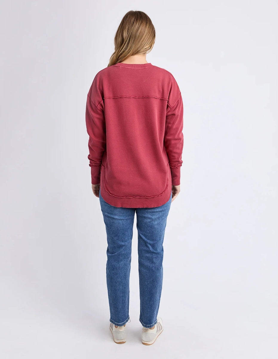 Back view of rust FOXWOOD sweatshirt with jeans.