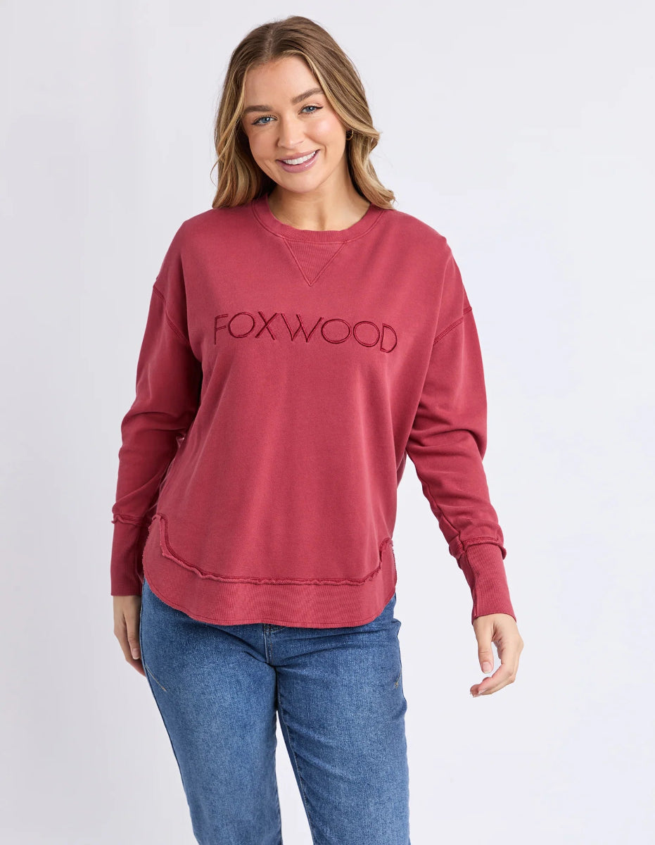Front view of rust foxwood sweatshirt styled casually.