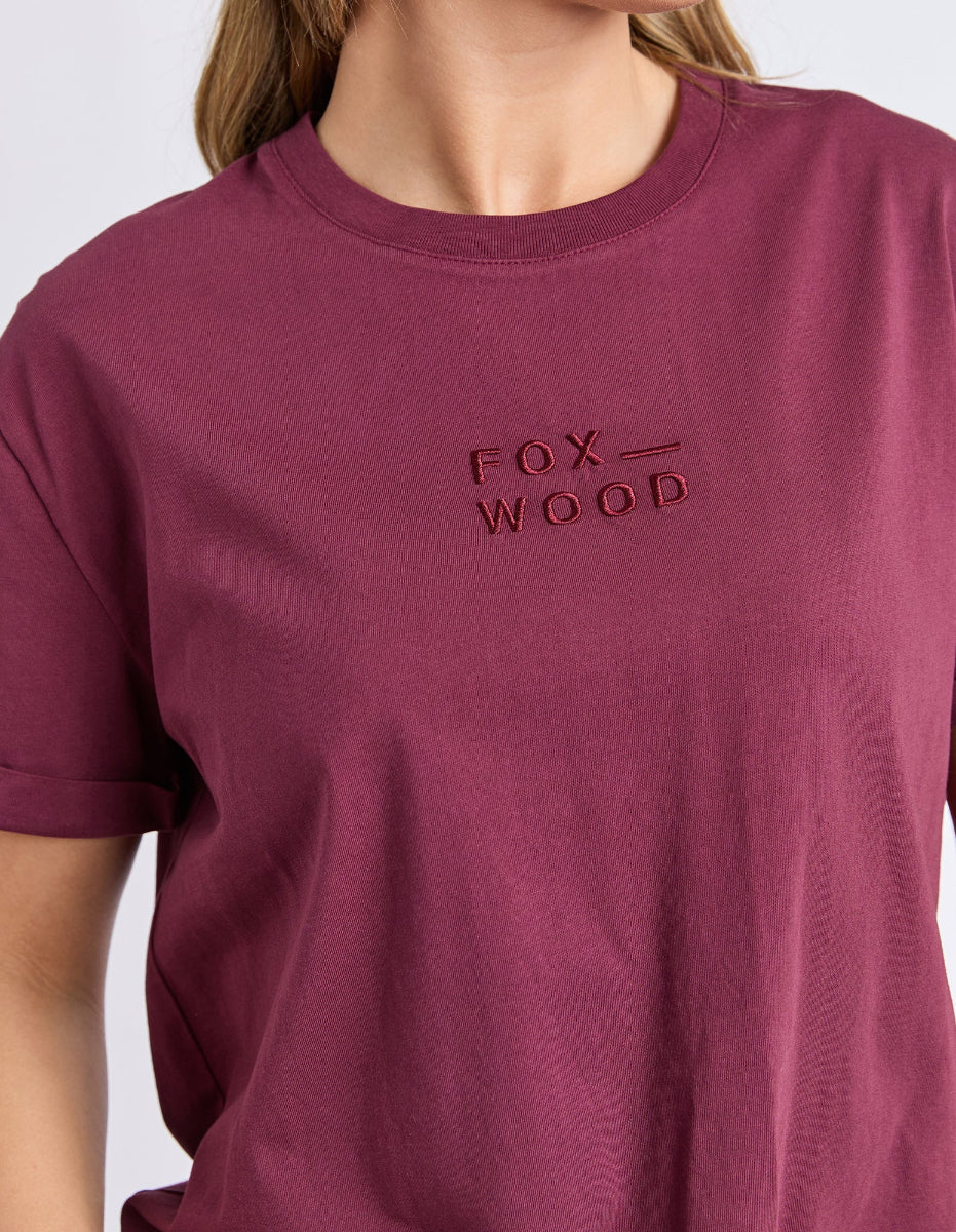 Close-up of wine Foxwood T-shirt logo and neckline.