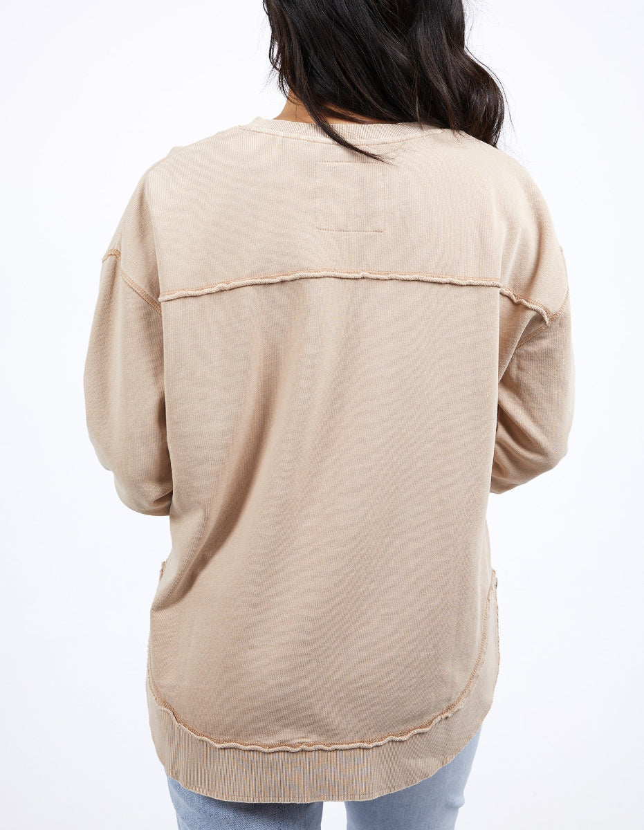 Back view of beige Foxwood sweatshirt with curved hem and seam detail.