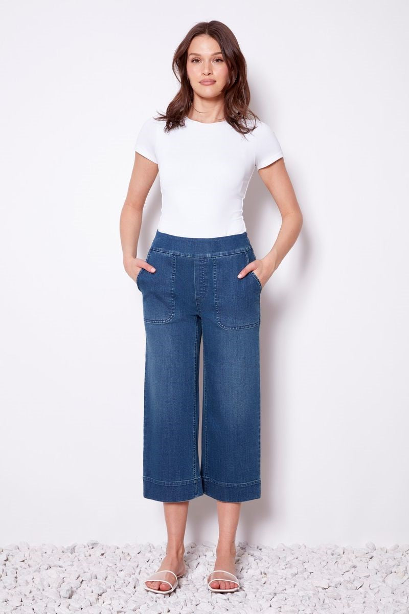 Front view of the Gaucho Denim Pant in medium blue from Ivy Vibe Boutique, featuring a wide-leg silhouette and modern denim style