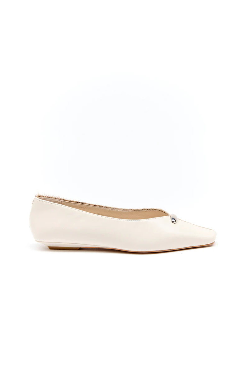 White flat shoe on a white background