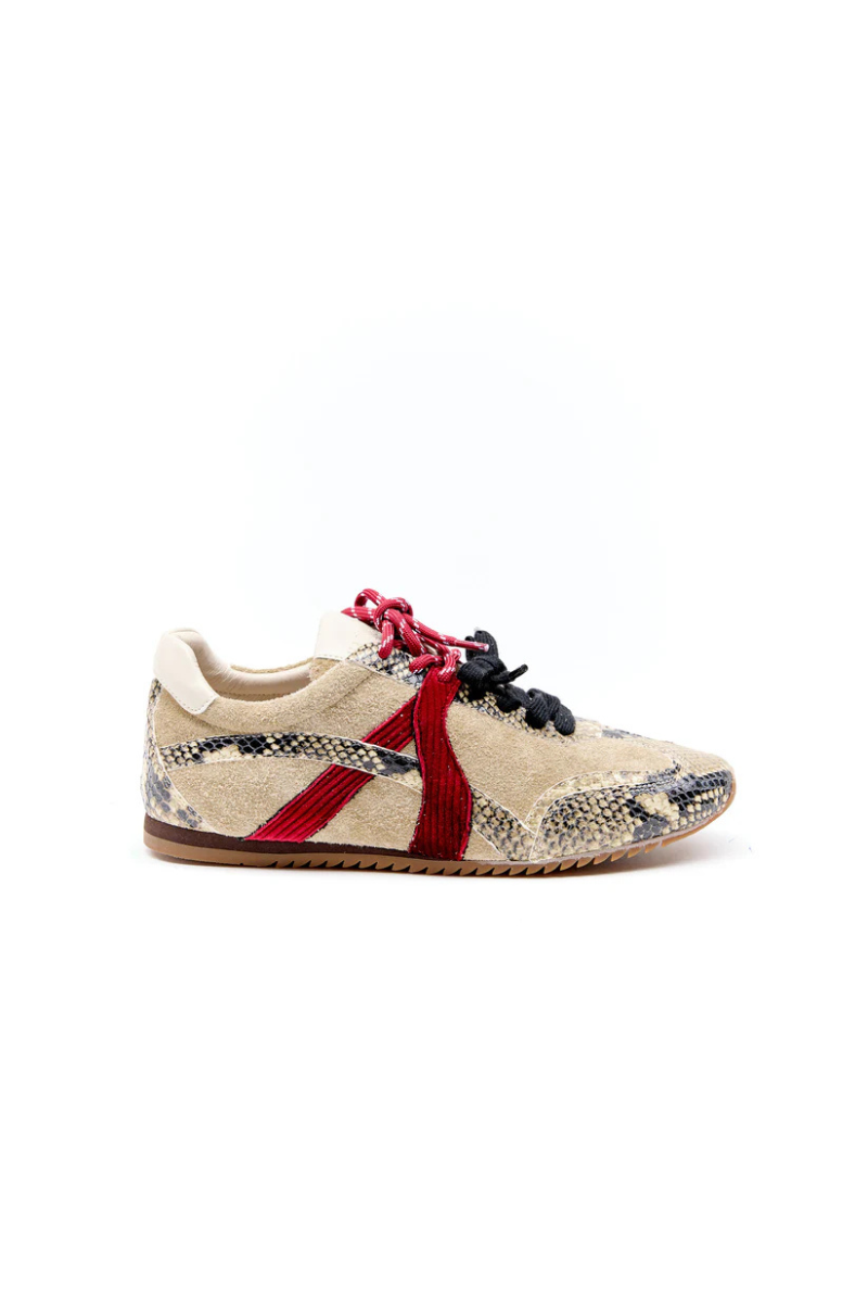 Sneaker with a snake pattern on a white background