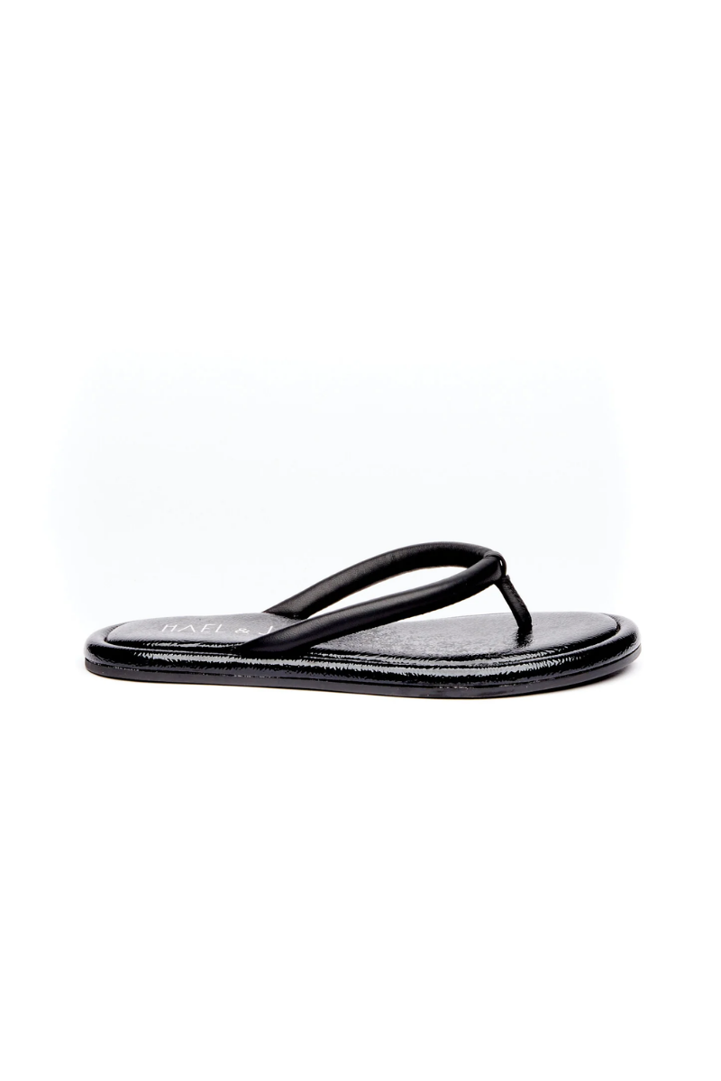 Brown sandal with a strap on a white background