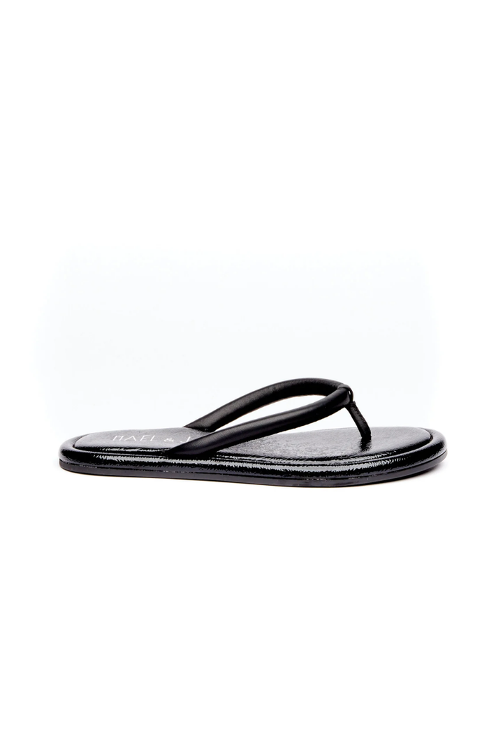 Brown sandal with a strap on a white background