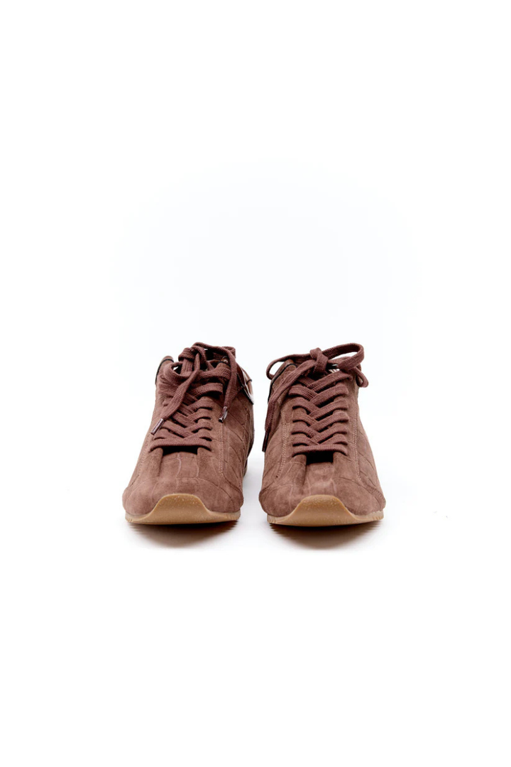 Pair of brown suede high-top shoes on a white background