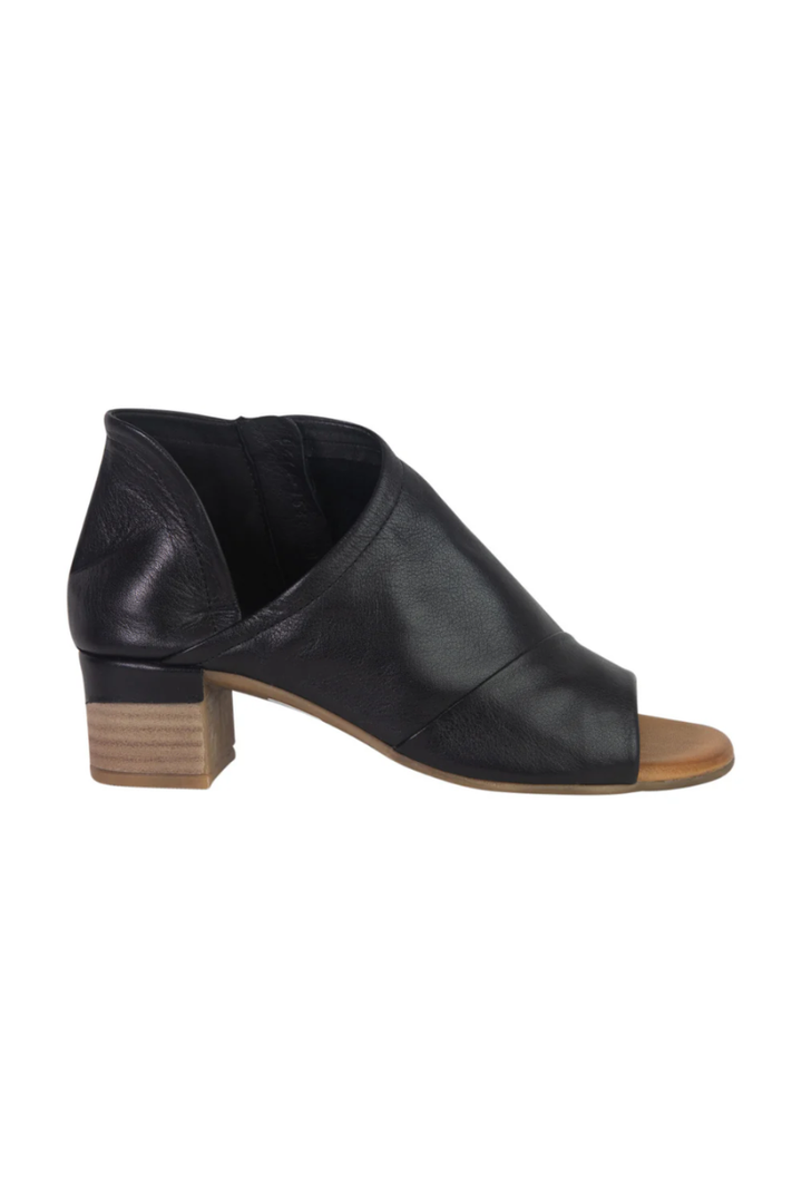 Black leather shoe with a wooden sole on a white background