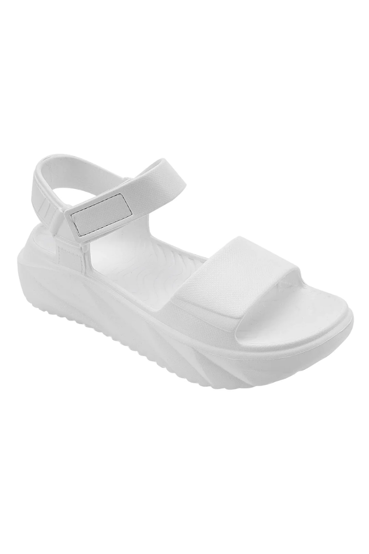 White sandal with a strap on a white background