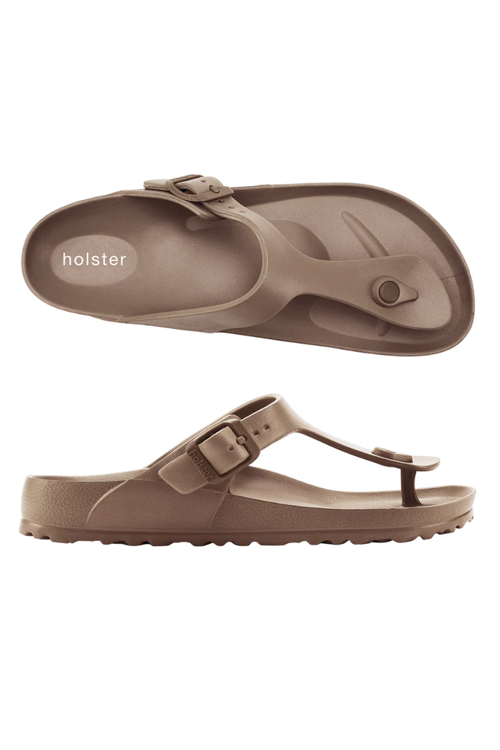 Brown sandals with a buckle on a white background