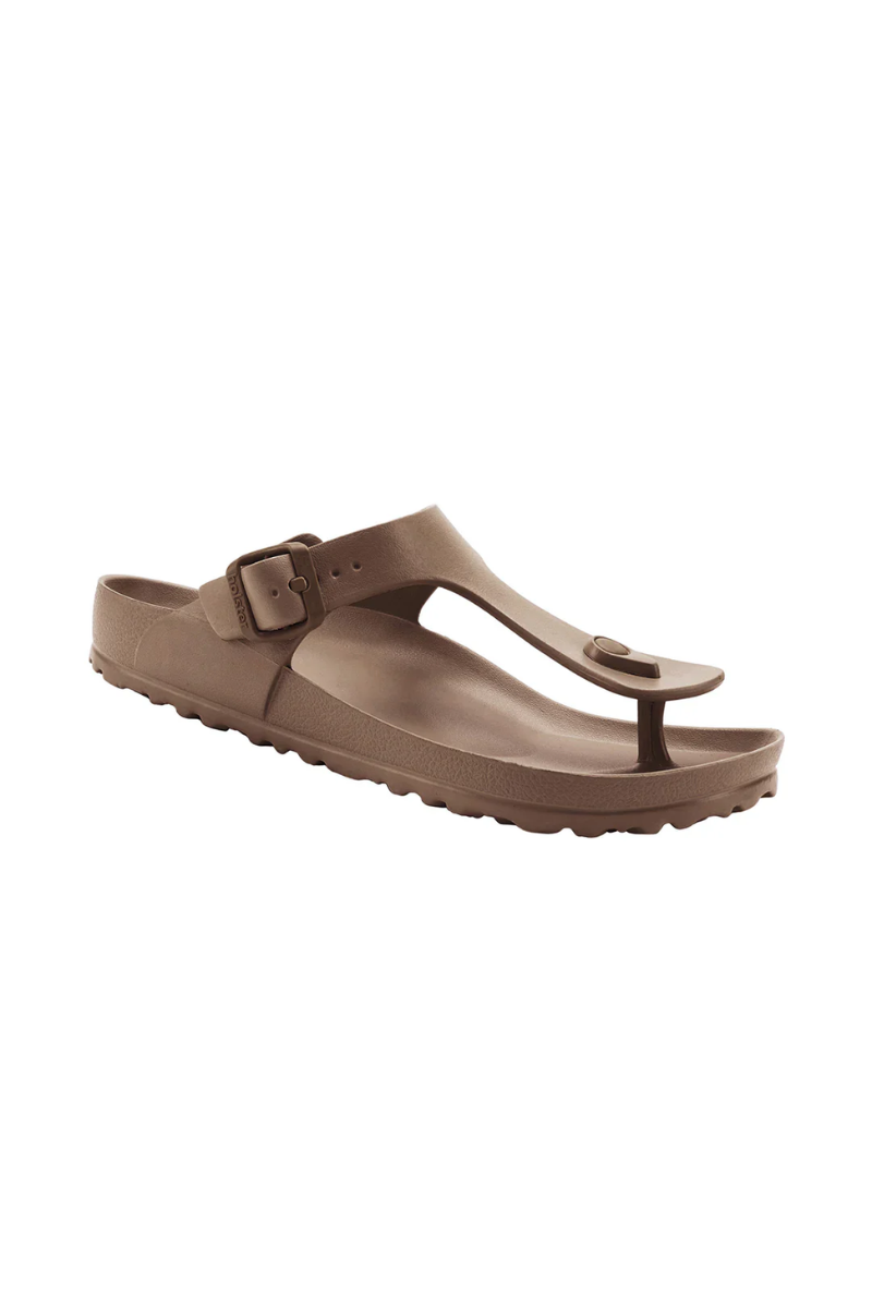 Brown sandals with a buckle on a white background