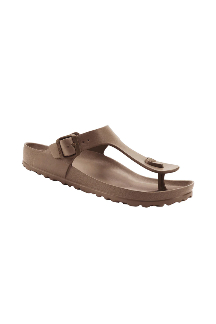 Brown sandals with a buckle on a white background