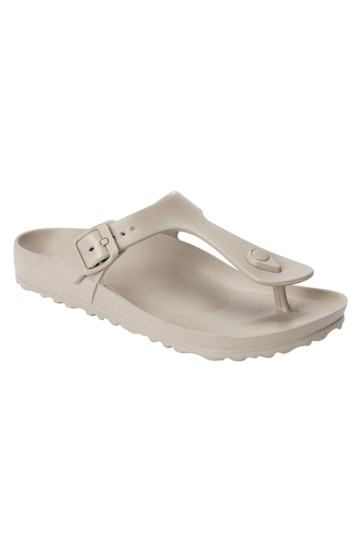 Beige sandal with a buckle on a white background