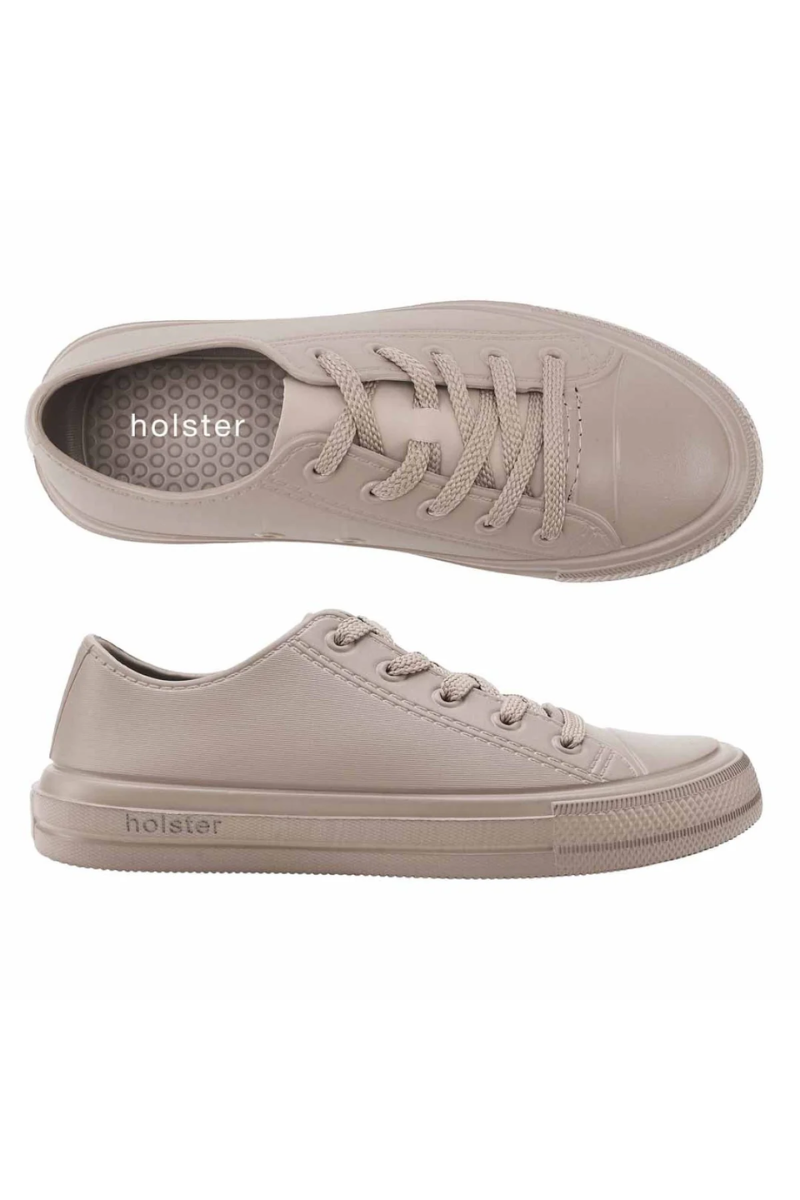 Pair of beige sneakers with 'holster' branding on a white background