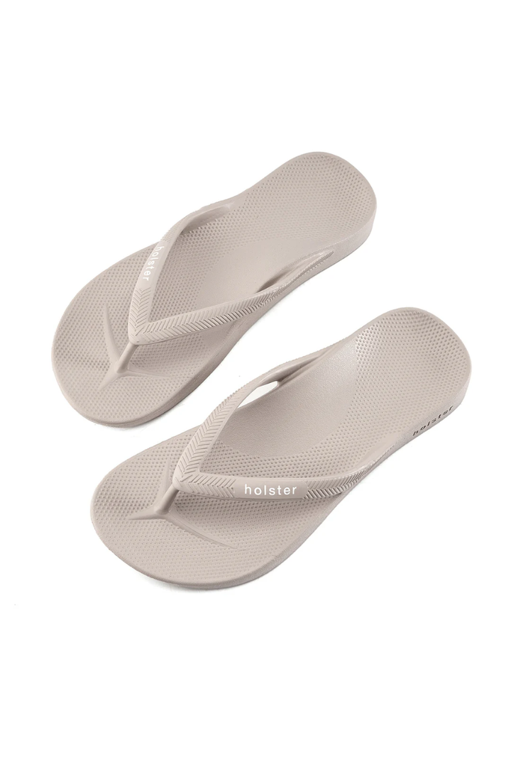 Pair of beige flip-flops with &