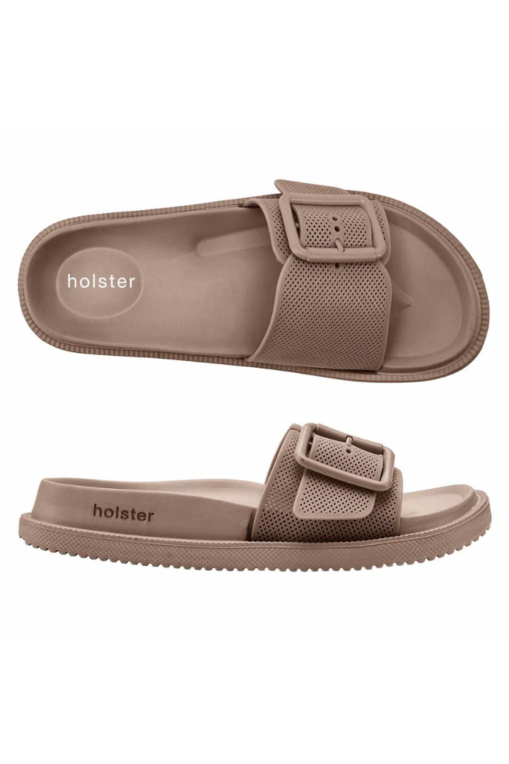 Brown sandals with a buckle on a white background, featuring the &