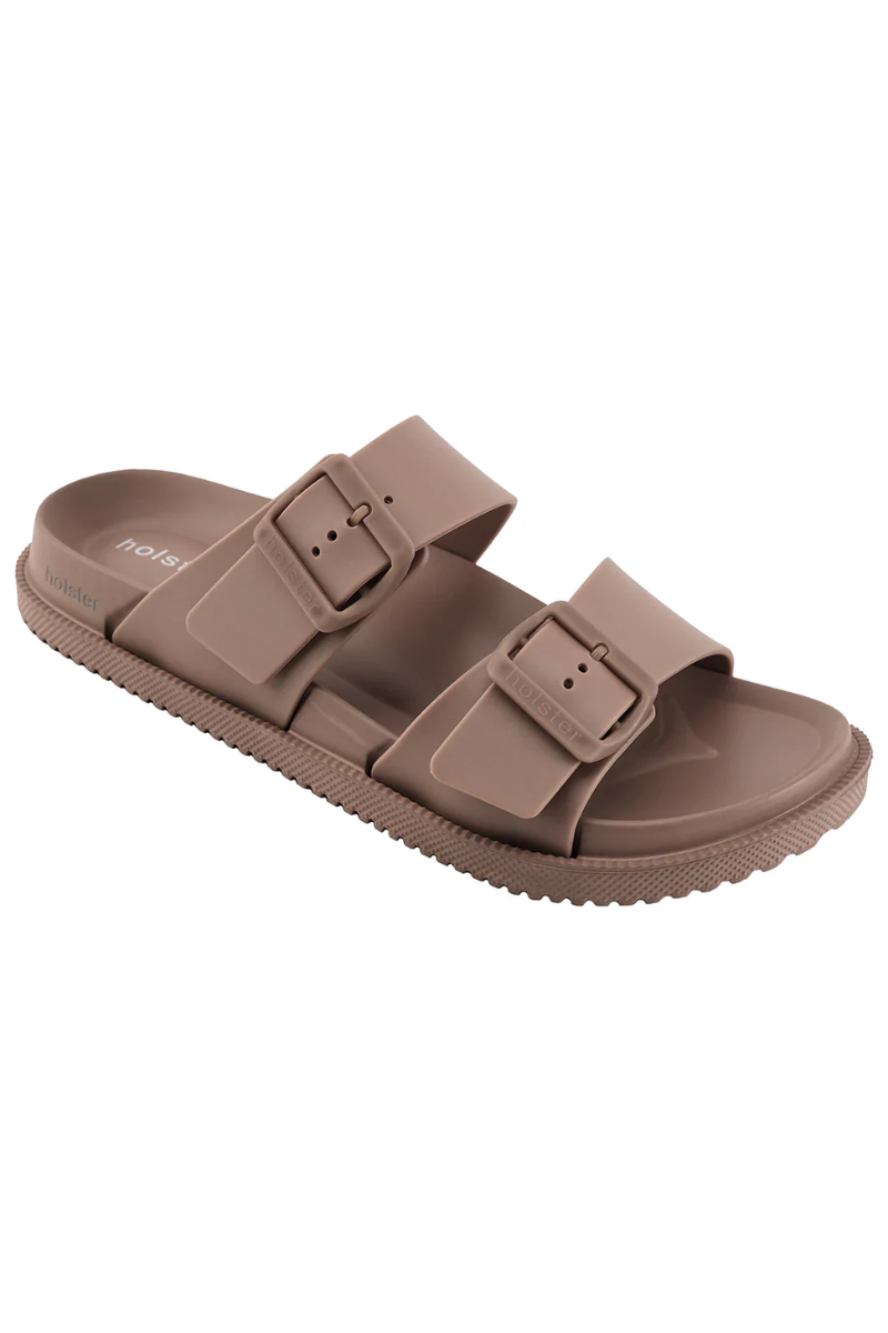 Brown sandal with buckle straps on a white background