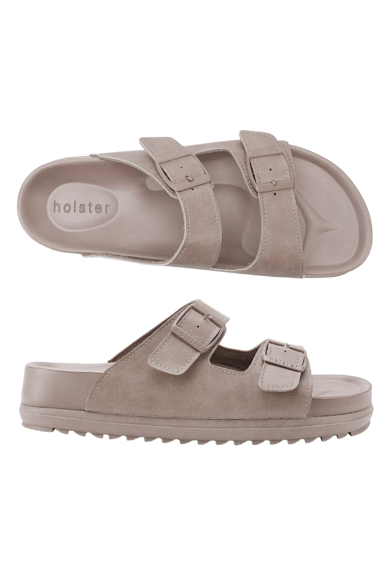 Pair of beige sandals with 'hoister' branding on a white background