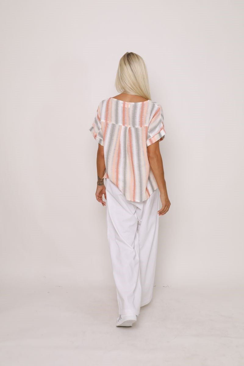 Back view of the Indrah Top in a striped pattern from Ivy Vibe, showing a relaxed silhouette with a straight hem and lightweight fabric drape.