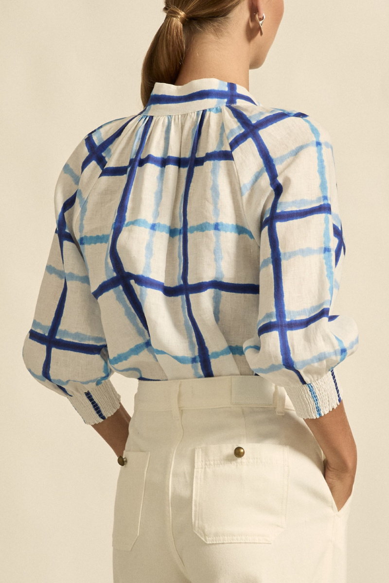 This close-up back view of the Inspire Top in Azure Check showcases the breathable linen texture, neat seam lines, and the elegant finish of the high stand collar.
