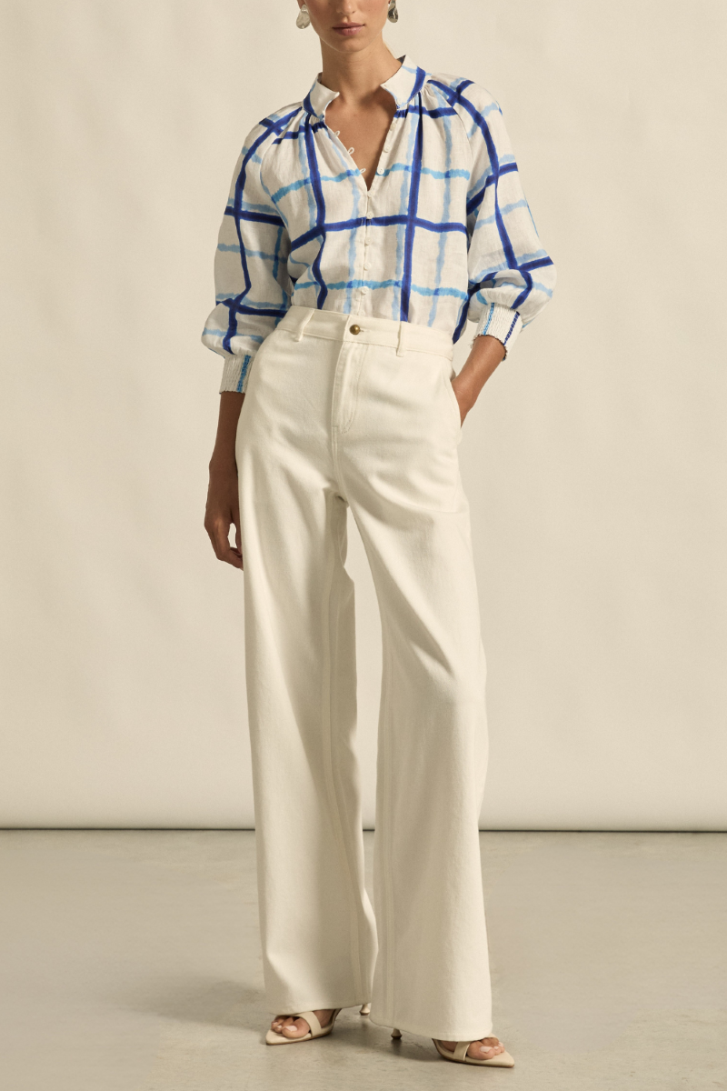 This front view of the Inspire Top in Azure Check showcases its high stand collar, relaxed fit, and lightweight 100% linen fabric with subtle check pattern.

