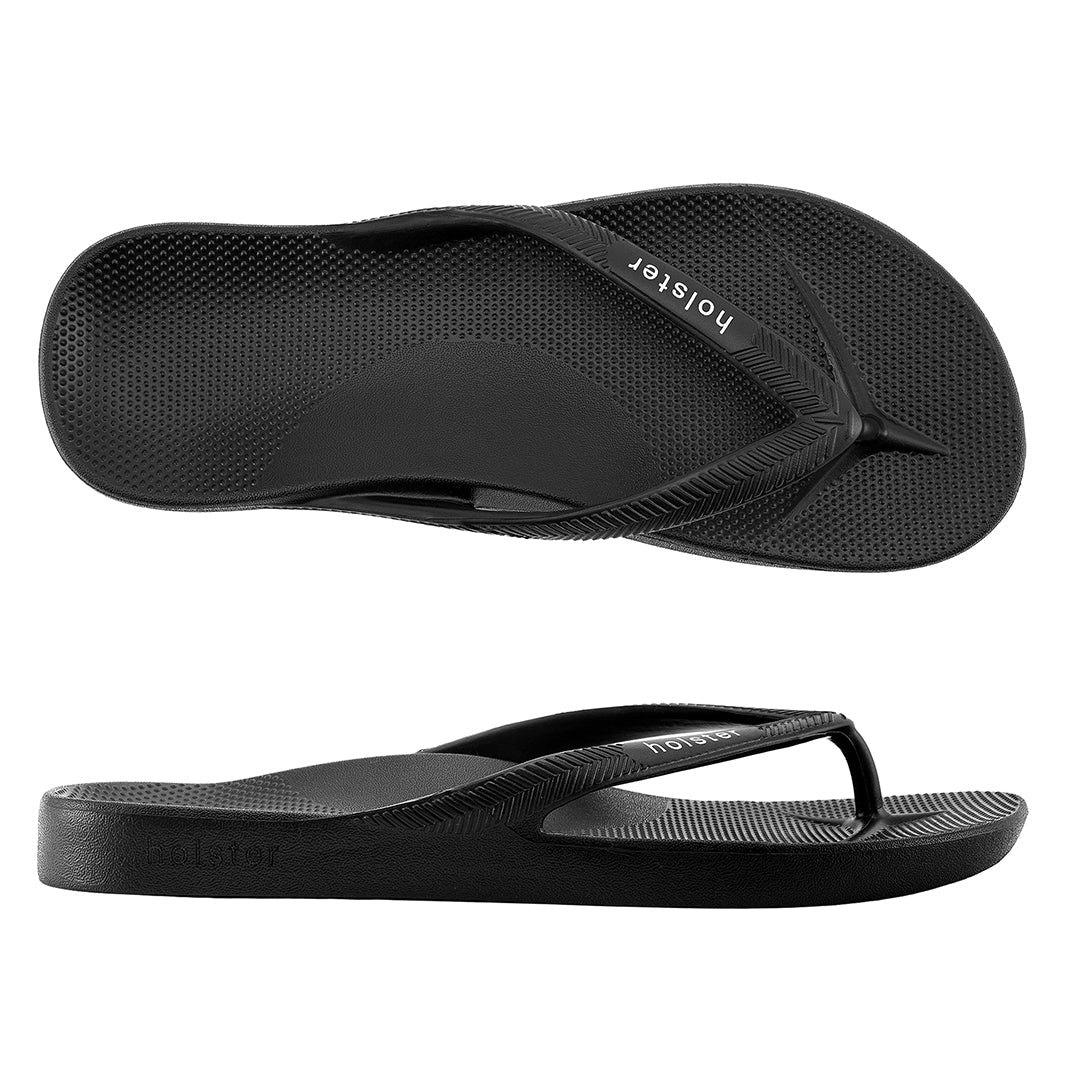 Black flip-flops with 'Hollister' branding on a white background