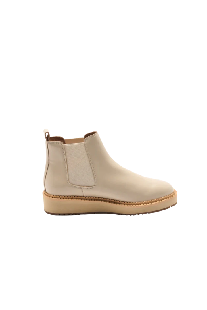 Beige ankle boot on a white background