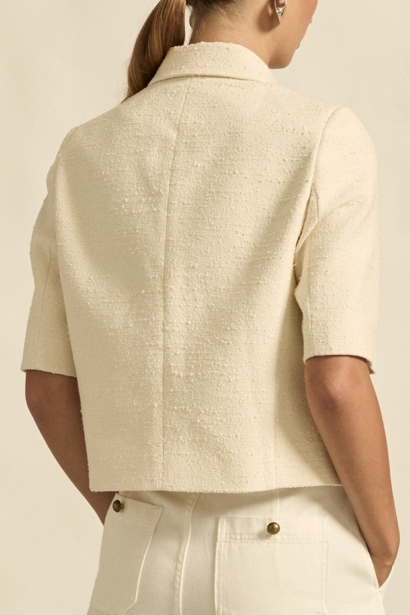 This back view of the Juncture Jacket in Alabaster highlights its tailored fit, subtle seam detailing, and streamlined design for a refined, elegant look.
