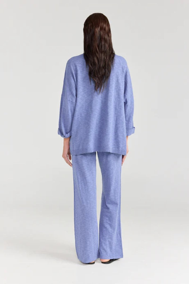 Woman wearing a blue outfit on a white background