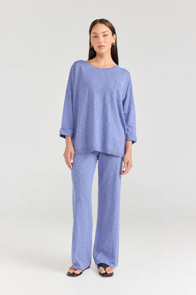 Woman wearing a blue outfit on a white background