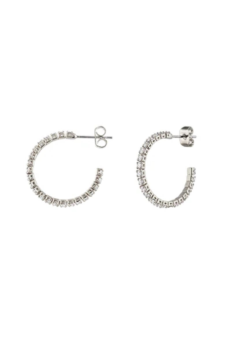 The Loretta Earrings in Silver by Zahar feature a bold, sculptural design with a polished finish, making them a standout statement piece — available at Ivy Vibe.
