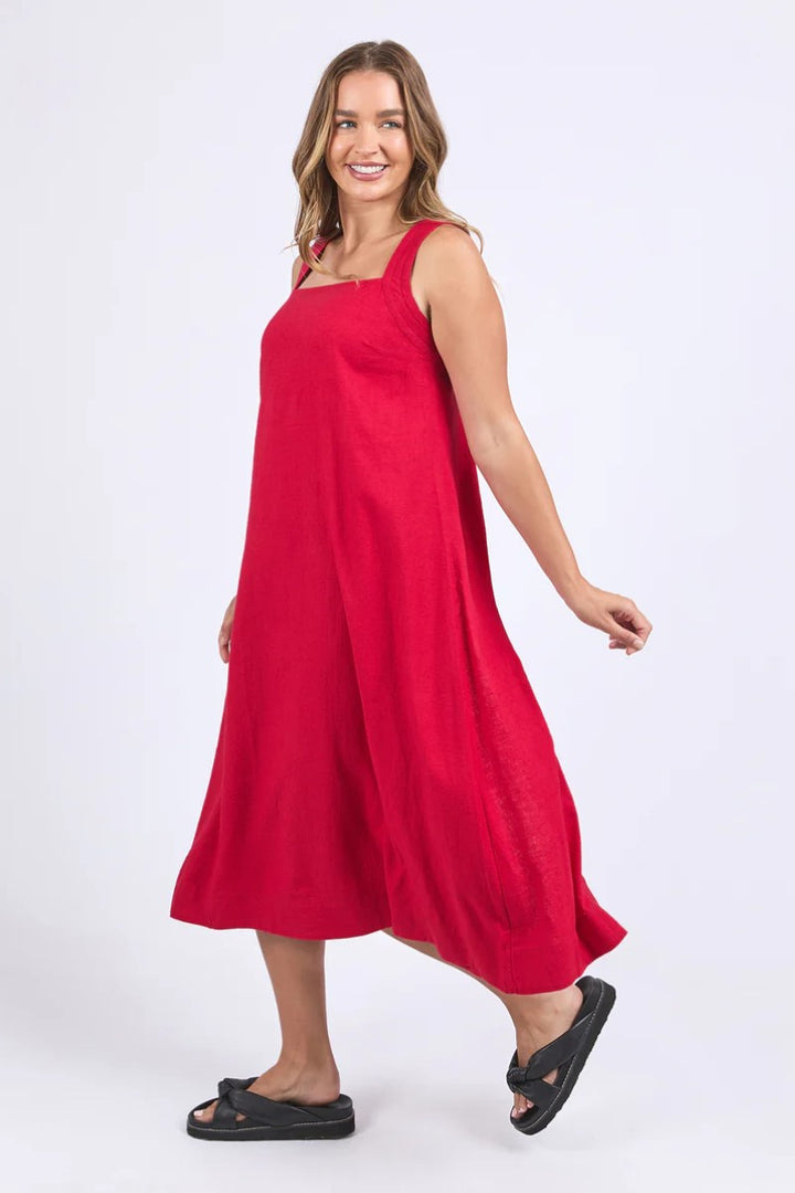 Woman wearing a red dress on a white background