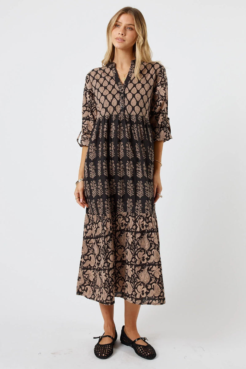 Woman wearing a black lace dress on a white background