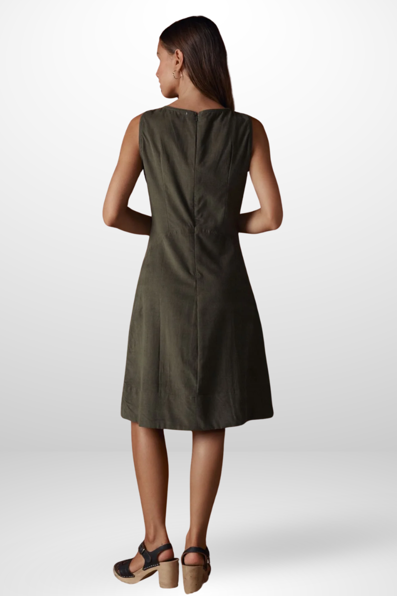 Woman wearing a green dress on a white background