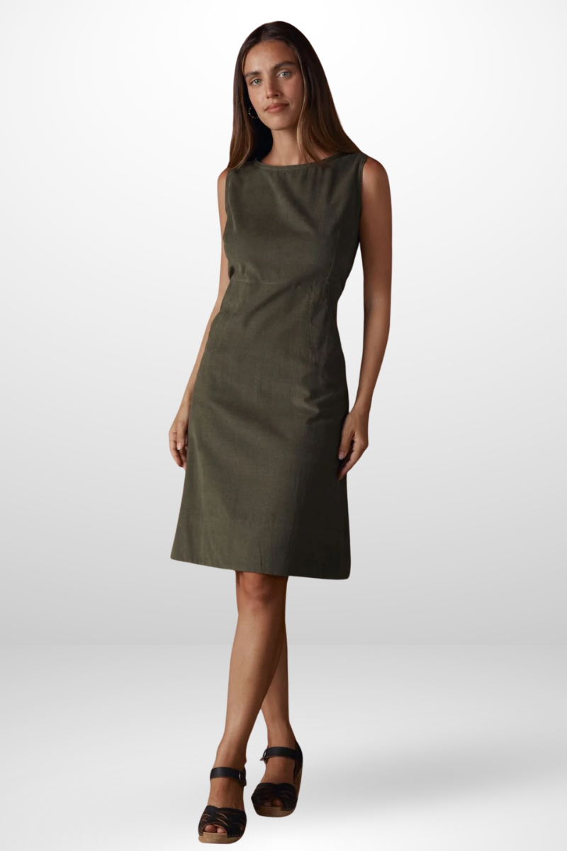 Woman wearing a green dress on a white background