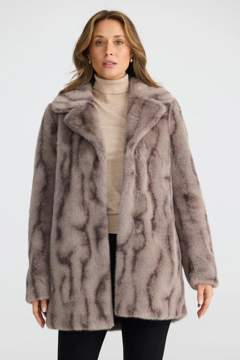 Front view of the Nadia Fur Coat in textured mink, featuring a lapel collar, fur hook closures, and mid-thigh length with in-seam pockets.