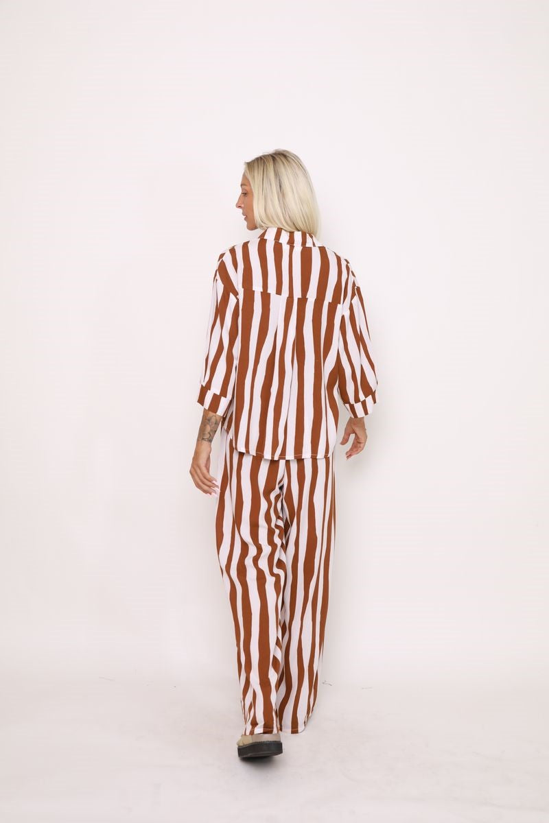 Back view of the Nirvana Stripe Shirt in Toffee/Cream, displayed at Ivy Vibe, featuring a relaxed fit and lightweight, breathable 100% rayon fabric.