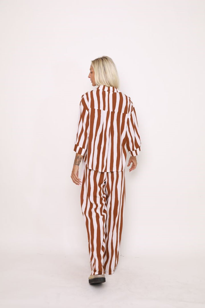 Back view of the Nirvana Stripe Shirt in Toffee/Cream, displayed at Ivy Vibe, featuring a relaxed fit and lightweight, breathable 100% rayon fabric.