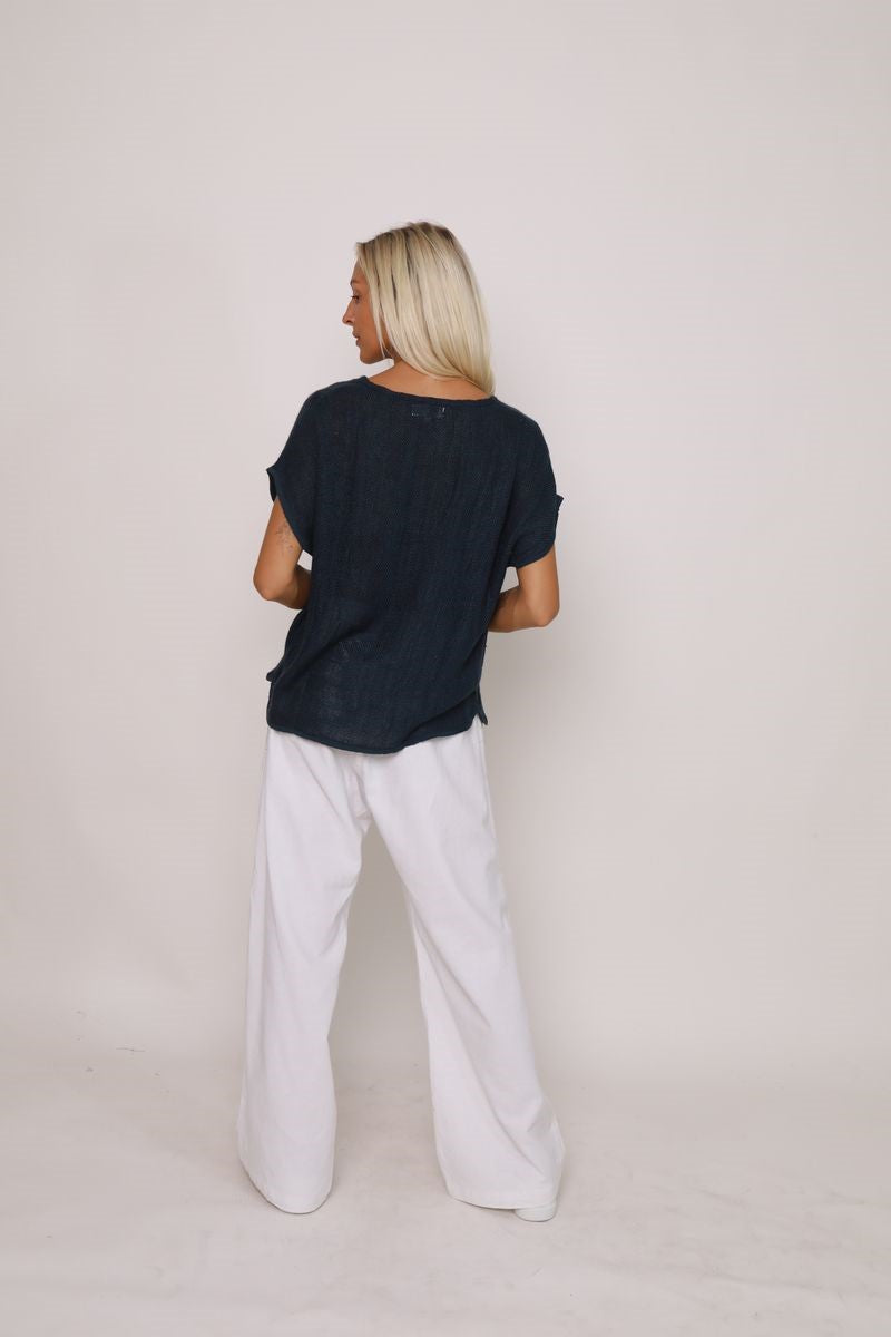 Back view of the Paris Top in black, displayed at Ivy Vibe, featuring a relaxed fit and breathable handwoven midweight cotton fabric.