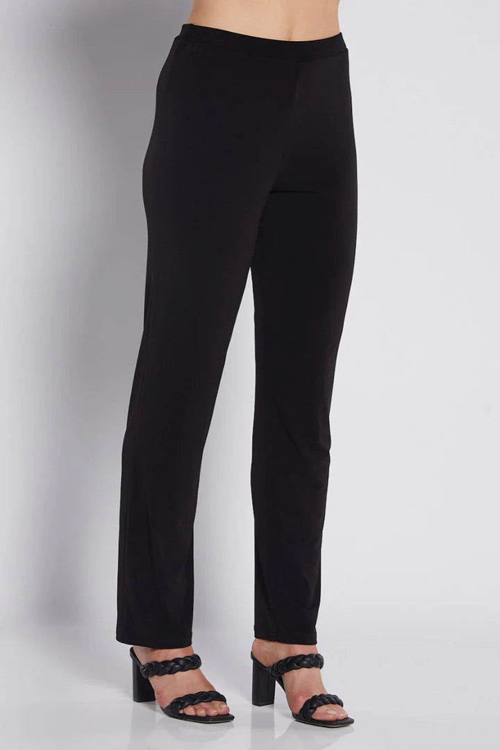 Black pants worn by a person on a white background