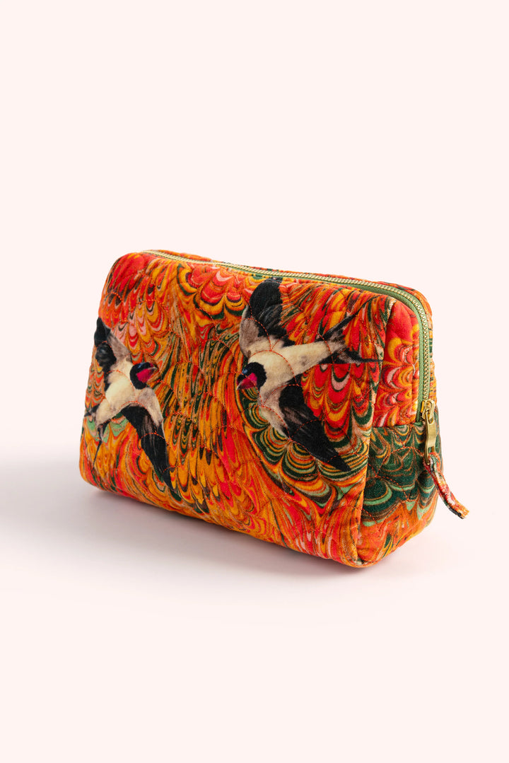 Colorful pouch with artistic design on a white background