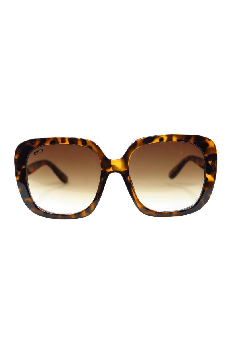 Oversized square sunglasses with a brown and black tortoiseshell patterned frame and gradient brown lenses, shown against a plain white background.