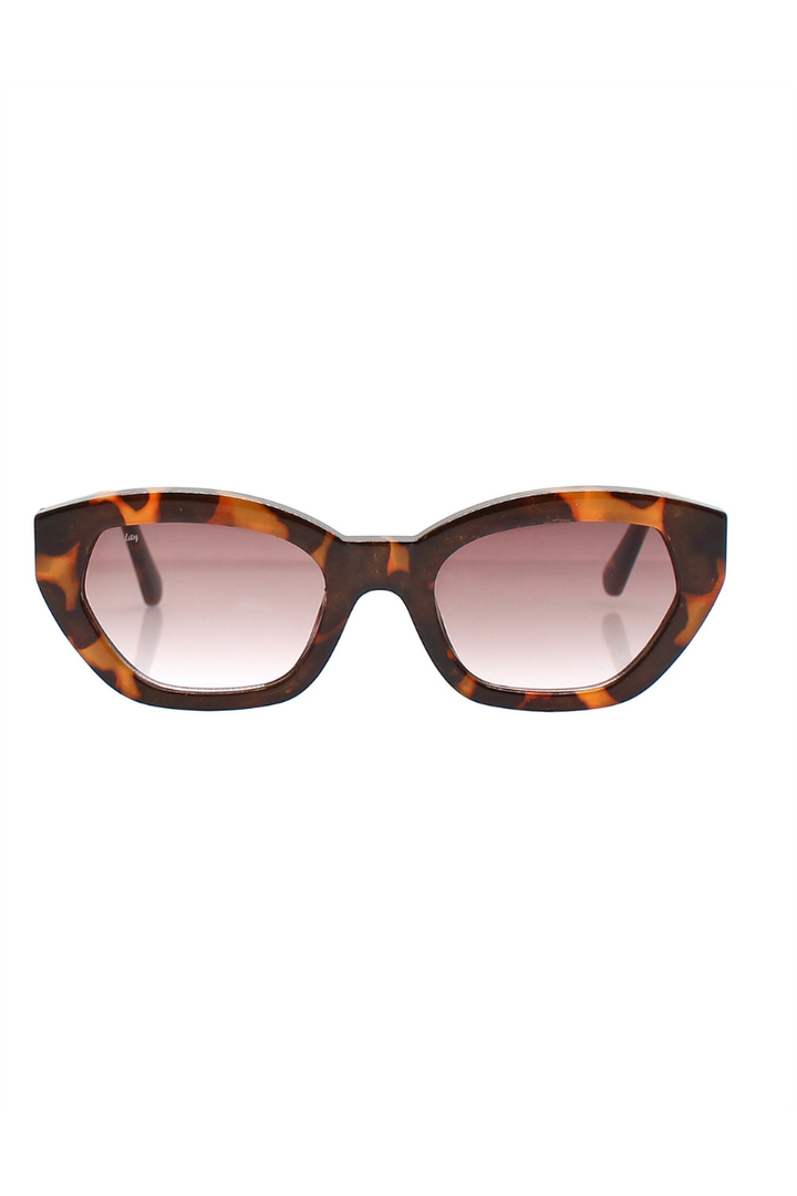 Tortoiseshell cat-eye sunglasses with gradient lenses on a white background