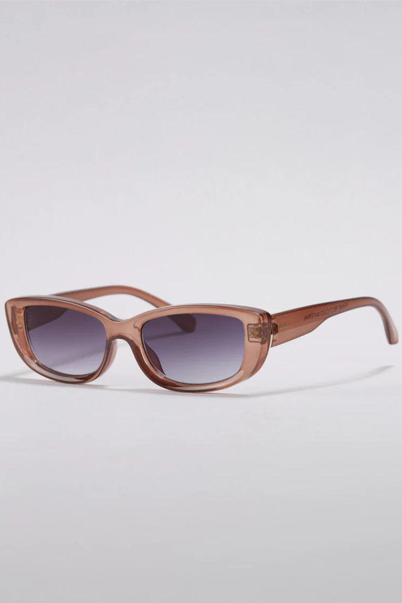 Sunglasses with a brown frame and gradient lenses on a light gray background