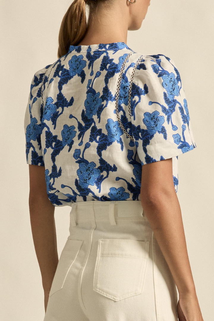 This close-up back view of the Recollect Top in Azure Bouquet showcases the fine linen texture, subtle seam detailing, and the delicate finish at the neckline and shoulders.
