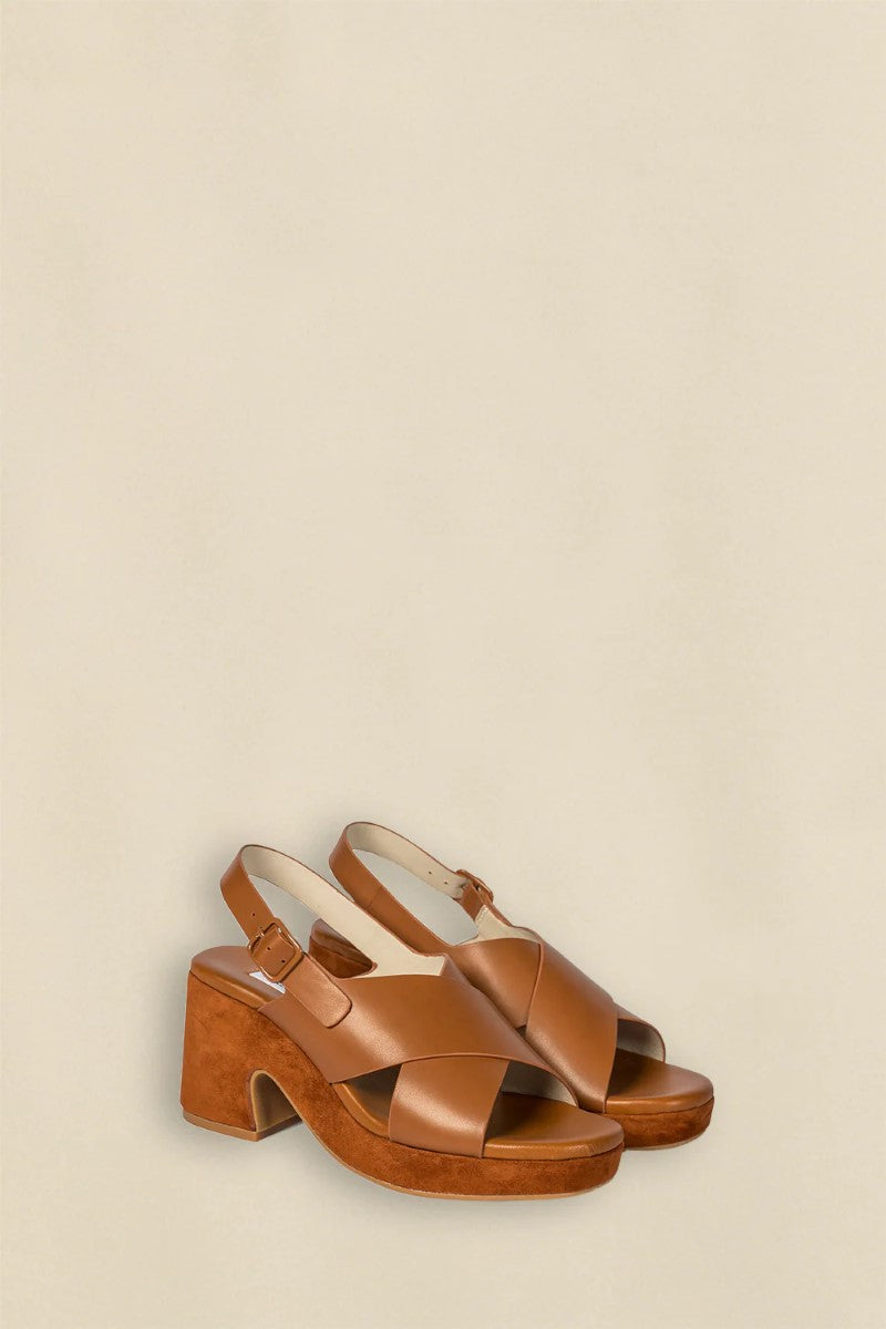 Side view of the Revel Heel in Saddle, highlighting its sleek shape, smooth finish, and mid-height block heel.