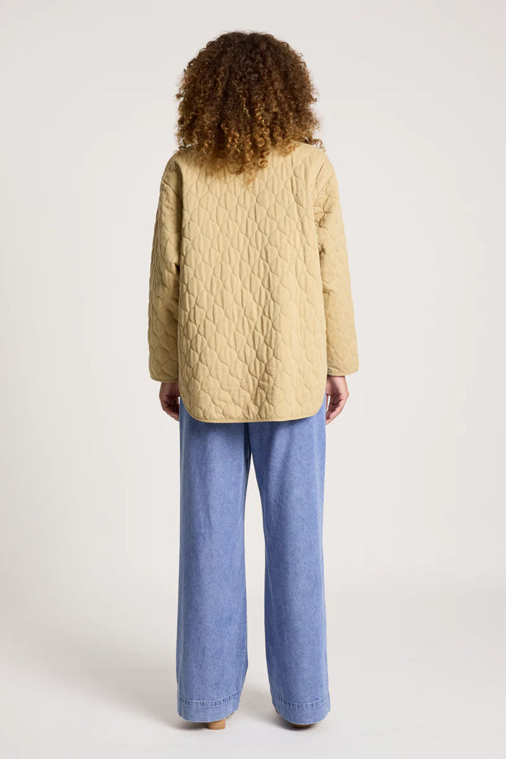 woman wearing Sansi Quilted Jacket in Dune