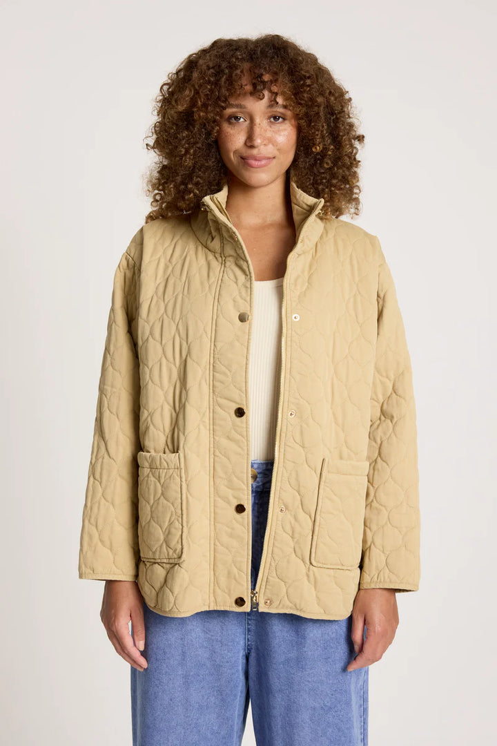 woman wearing Sansi Quilted Jacket in Dune