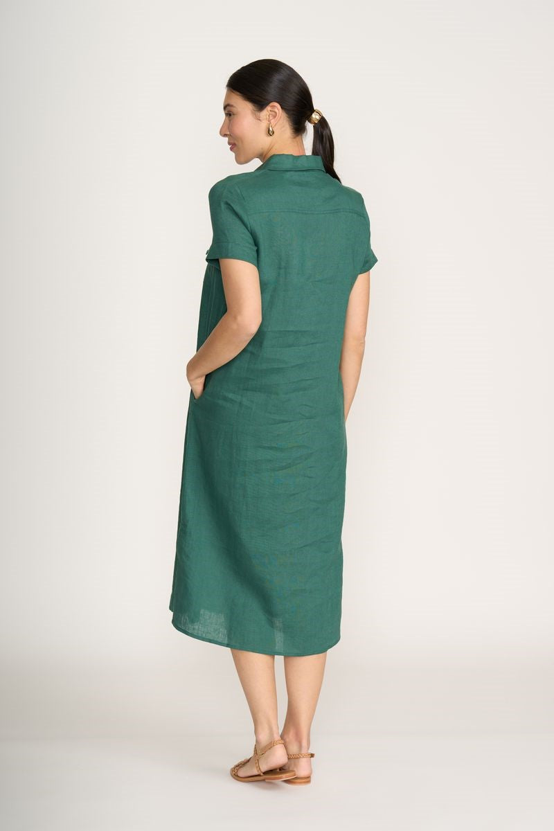 Woman wearing a green dress on a white background