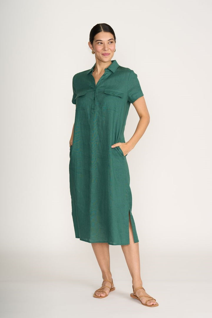 Woman wearing a green dress on a white background
